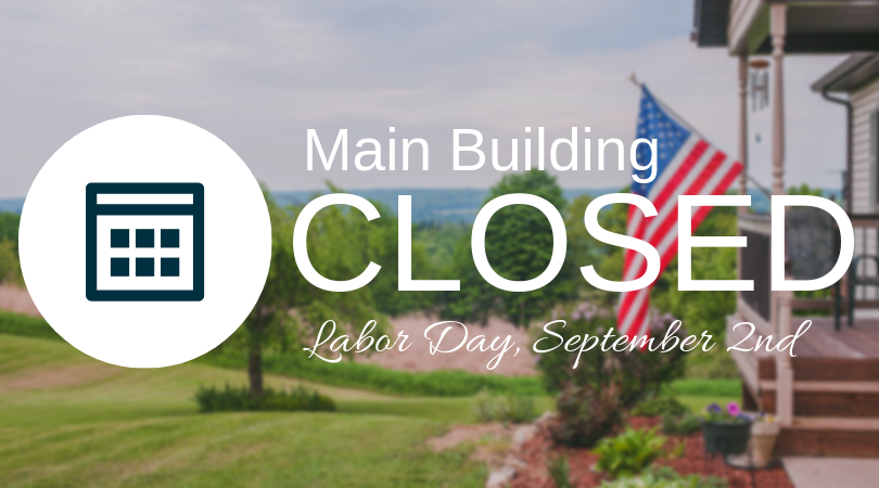 Image of front porch with flag hanging. Text says: Main Building Closed Monday, September 2nd, for Labor Day