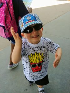 photo of Nolan wearing sunglasses and waving